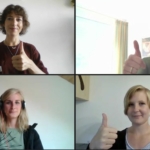 Webcam-Bild mit Personen die Daumen heben